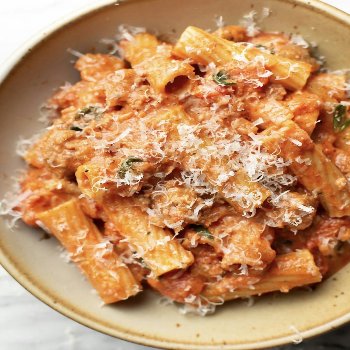 Rigatoni coated in a creamy tomato sauce topped with grated parmesan