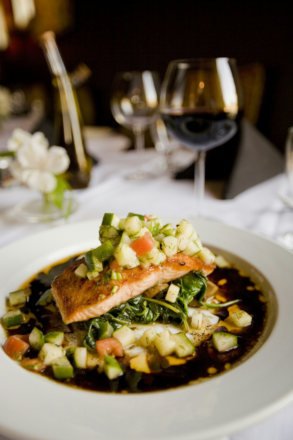 Seared salmon fillets with lemon slices and fresh parsley