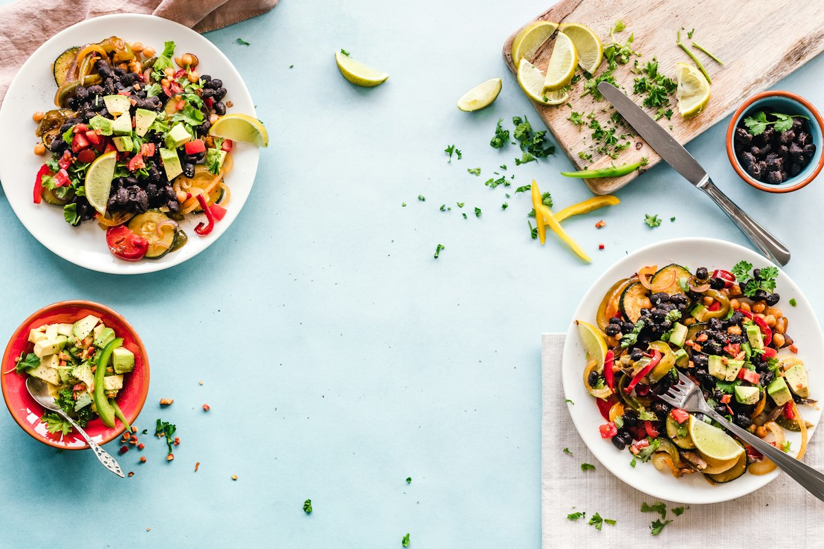 Meal prep containers filled with grains, vegetables and protein
