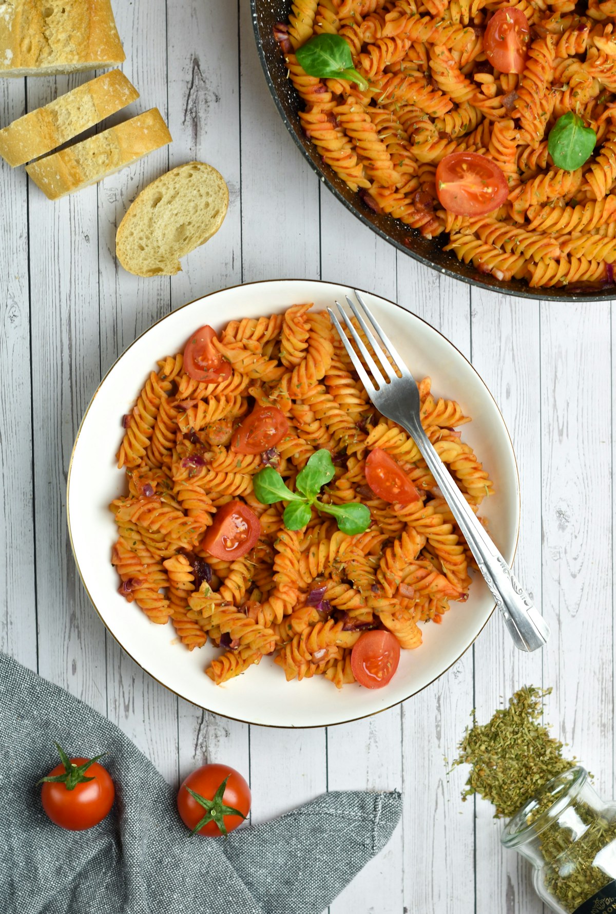 Fusilli in a smoky tomato sauce with cherry tomatoes and basil