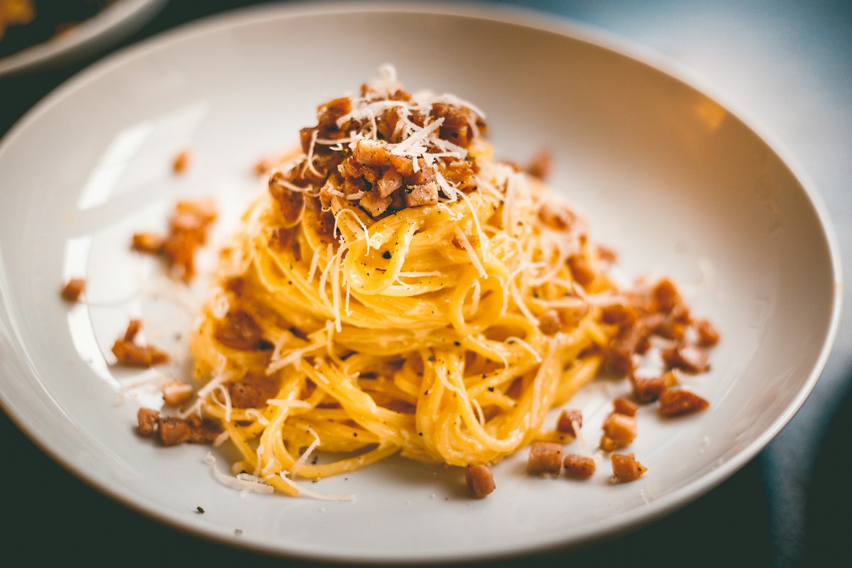 Spaghetti carbonara with crisp guanciale cubes and grated pecorino